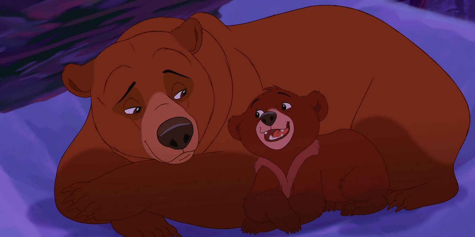 Two bears cuddling on the ground in Brother Bear