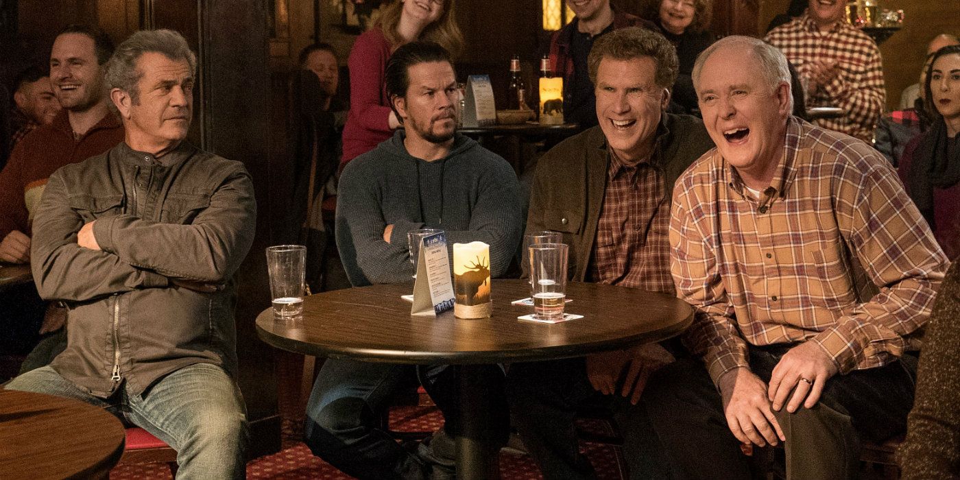 Cast of Daddy's Home 2 sit at a bar table.