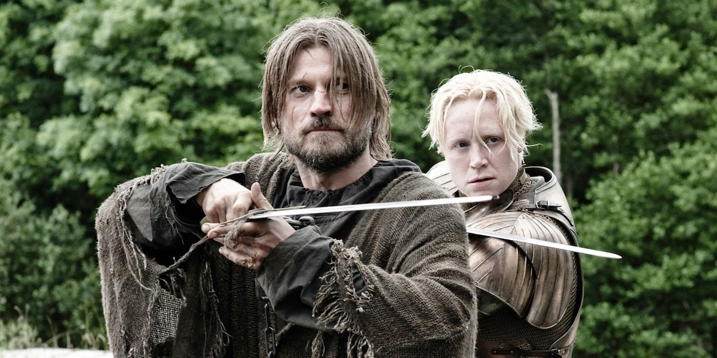 Jaime and Brienne pointing their swords in the same direction in Game of Thrones.