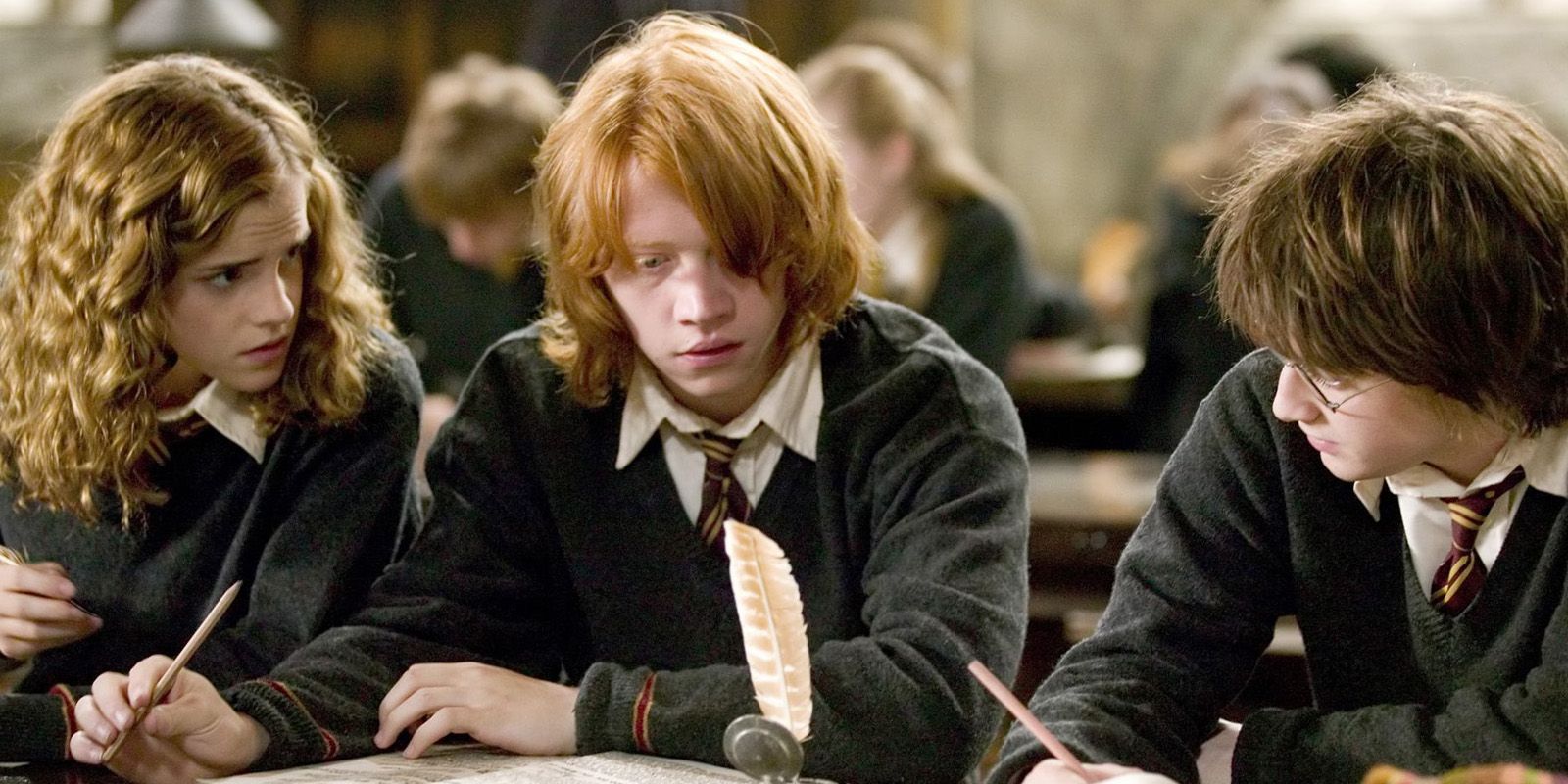 Harry Ron Hermione doing homework at Hogwarts