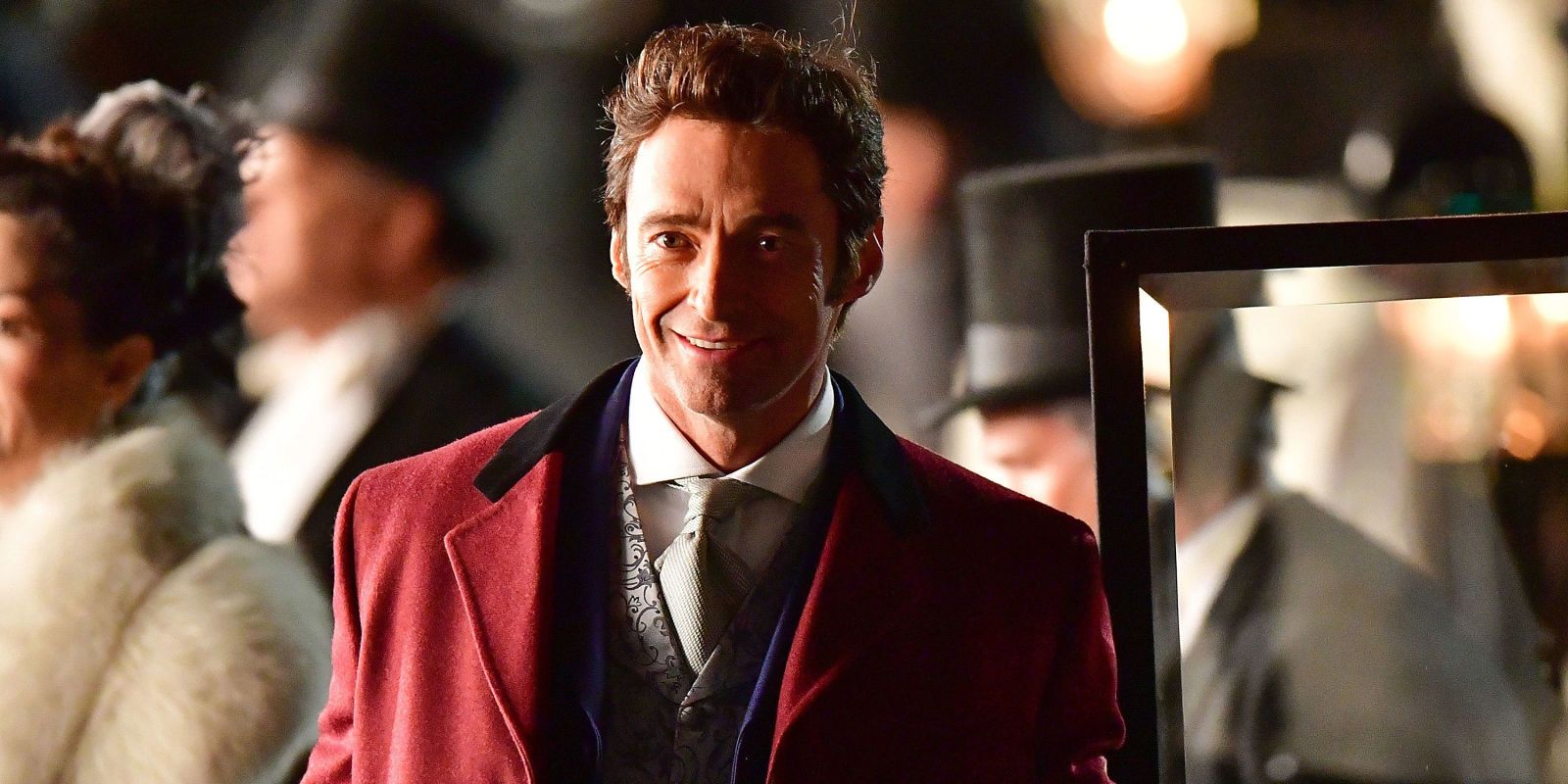 Hugh Jackman as P. T. Barnum smiling in The Greatest Showman