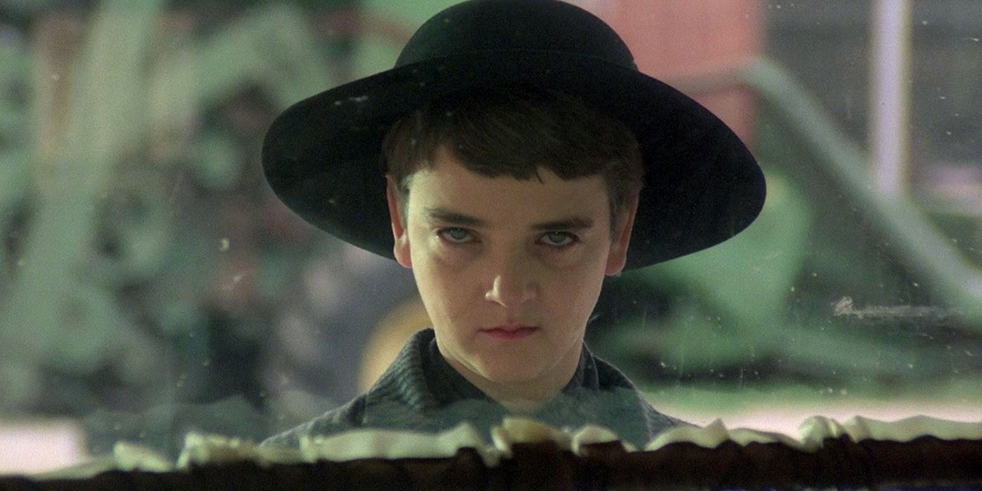 Isaac with a black hat and menacing stare in Children Of The Corn