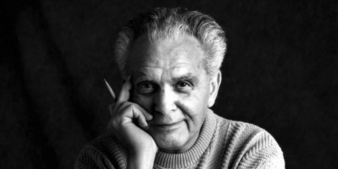 A black and white photo of Jack Kirby.