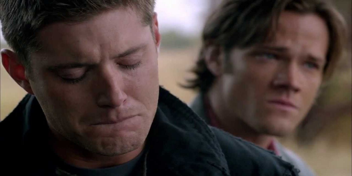 Dean crying as Sam looks on in Supernatural