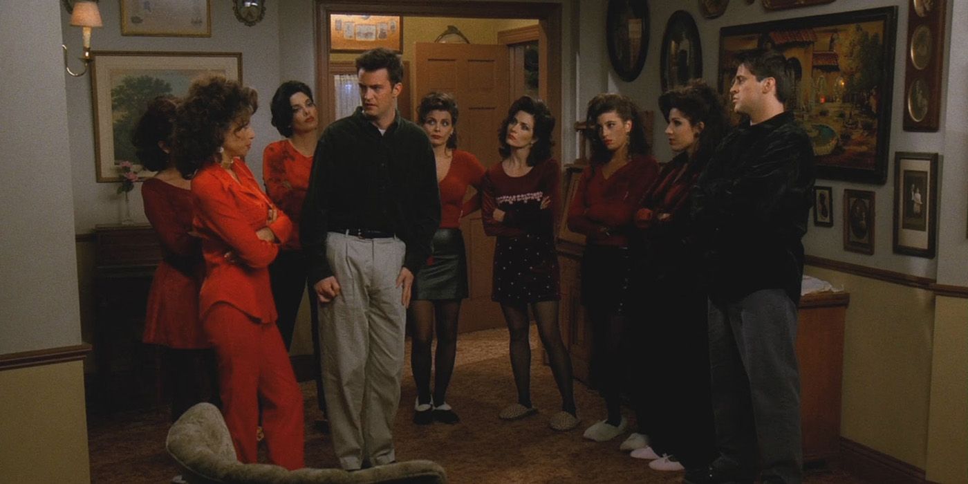 Chandler is surrounded by Joey's sisters staring him down intimidatingly in Friends