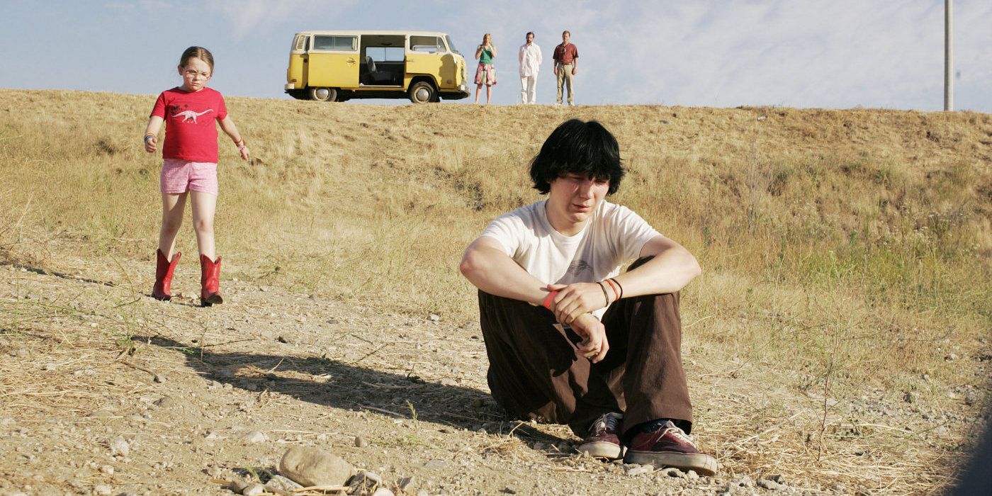 Olive (Abigail Breslin) walks to console her brother Dwayne (Paul Dano) as he sits on the ground in Little Miss Sunshine