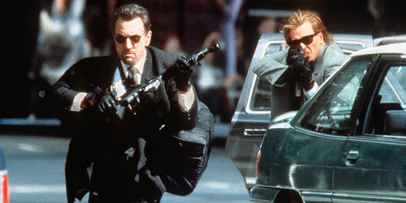 Robert De Niro and Val Kilmer carrying guns in Heat.