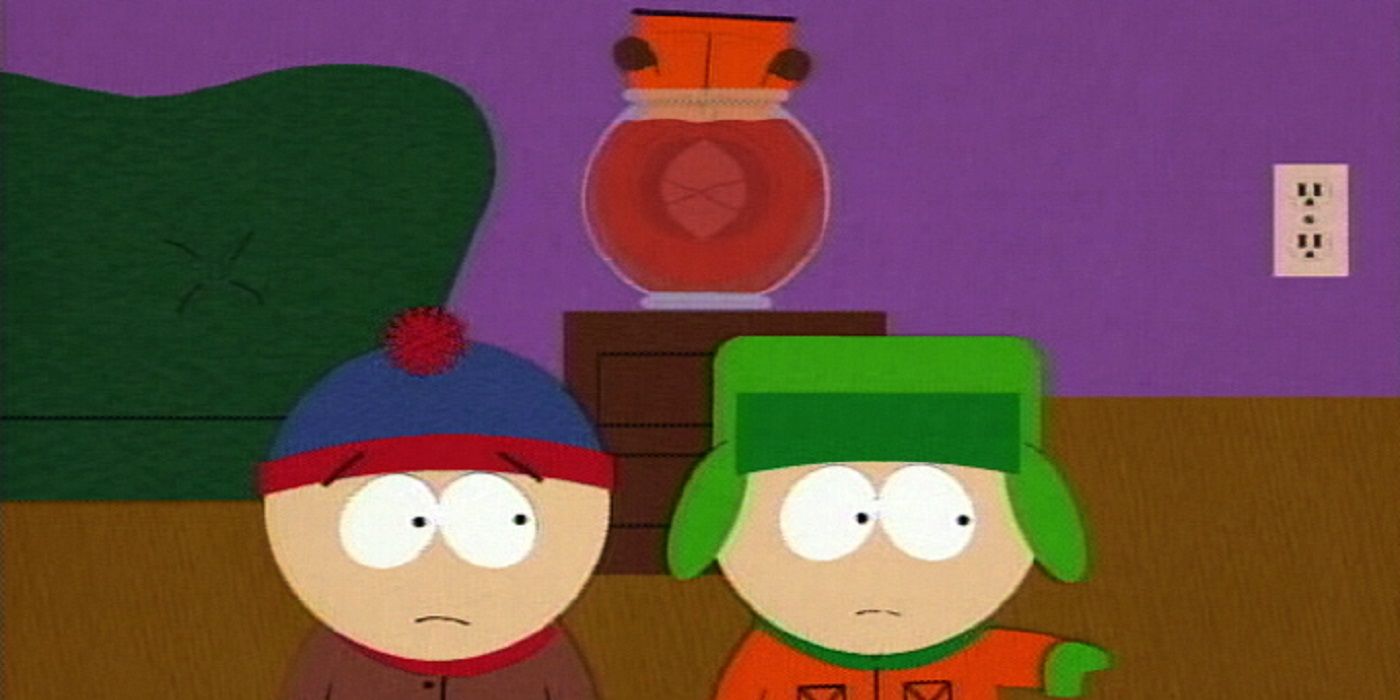 Stan and Kyle looking at something in the foreground with Kenny's head in a fish bowl in the background in South Park.