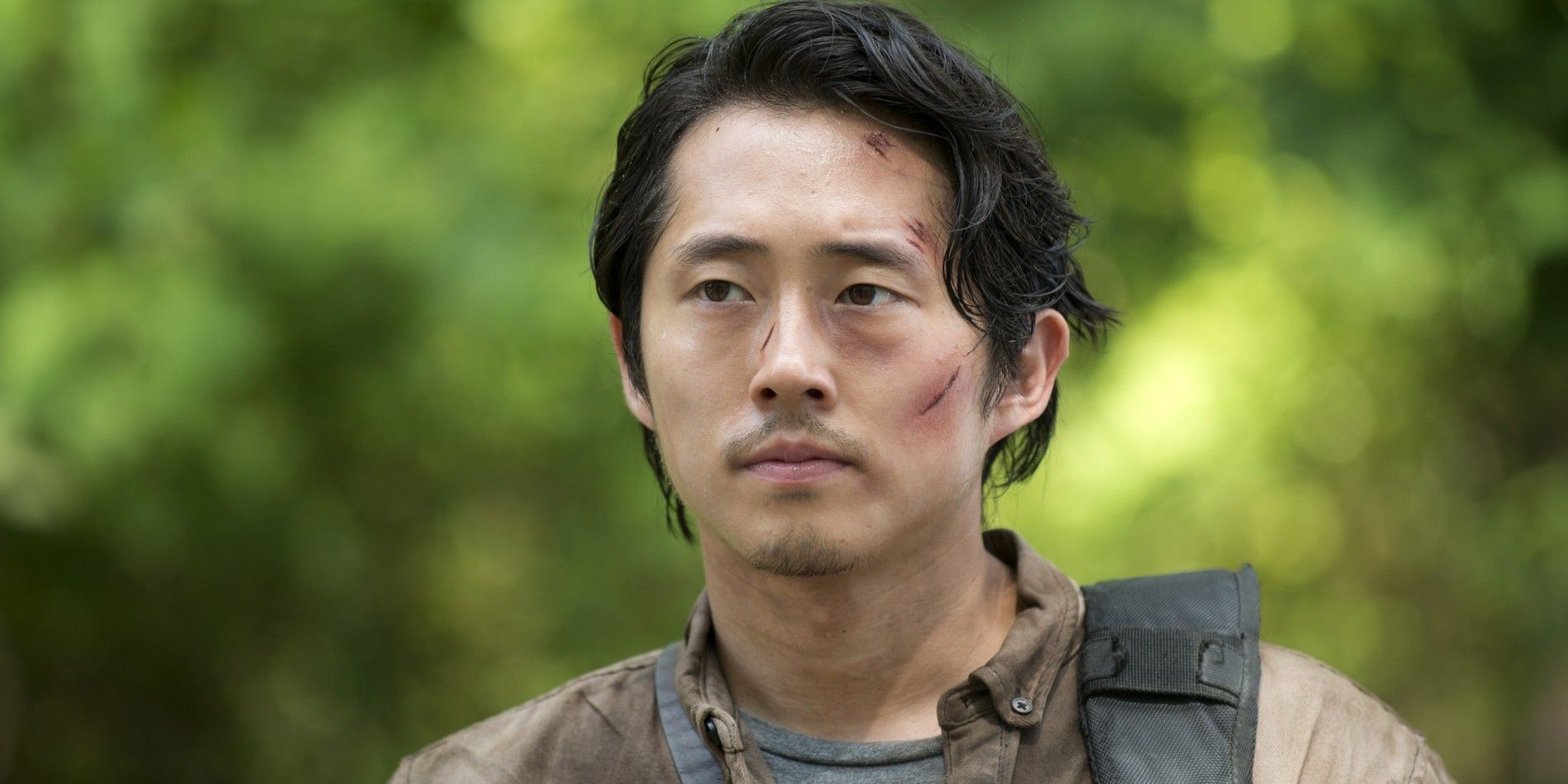 Steven Yeun as Glenn in The Walking Dead with cuts on his face