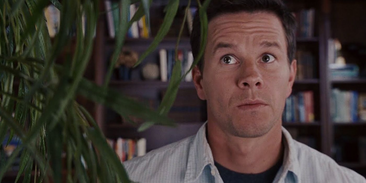Mark Wahlberg staring at a plant in The Happening