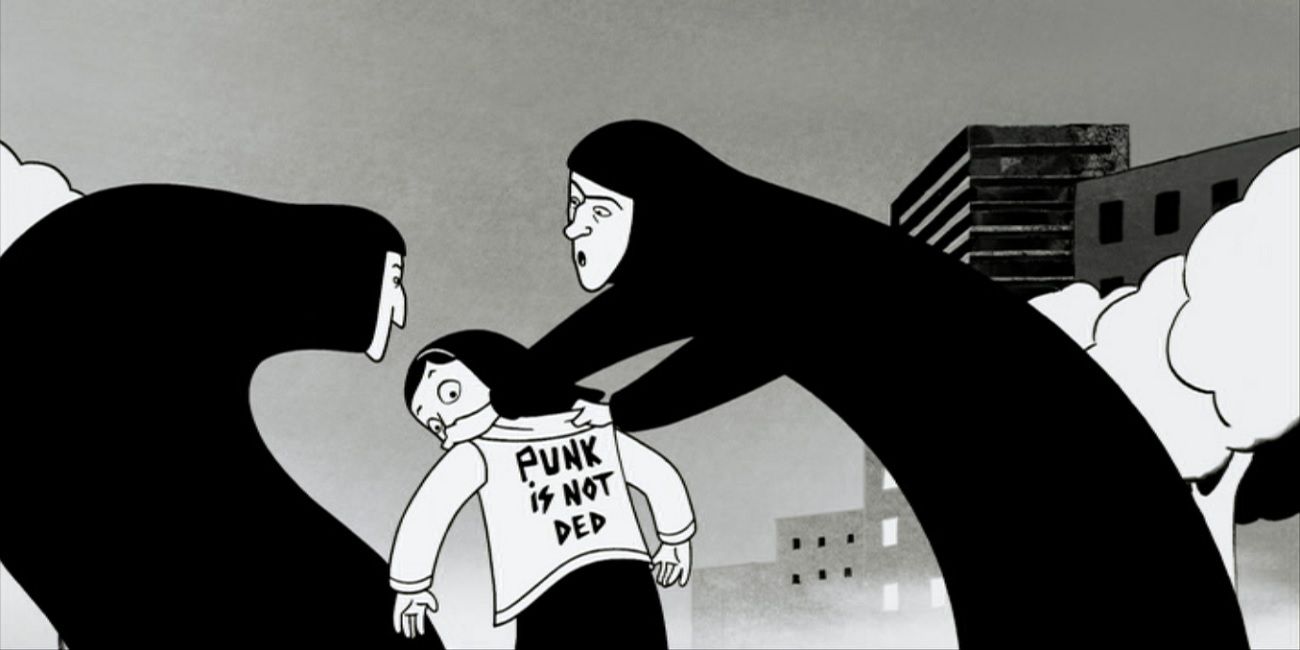 A woman hold a girl's shoulders and sees her t-shirt in a still from Persepolisis