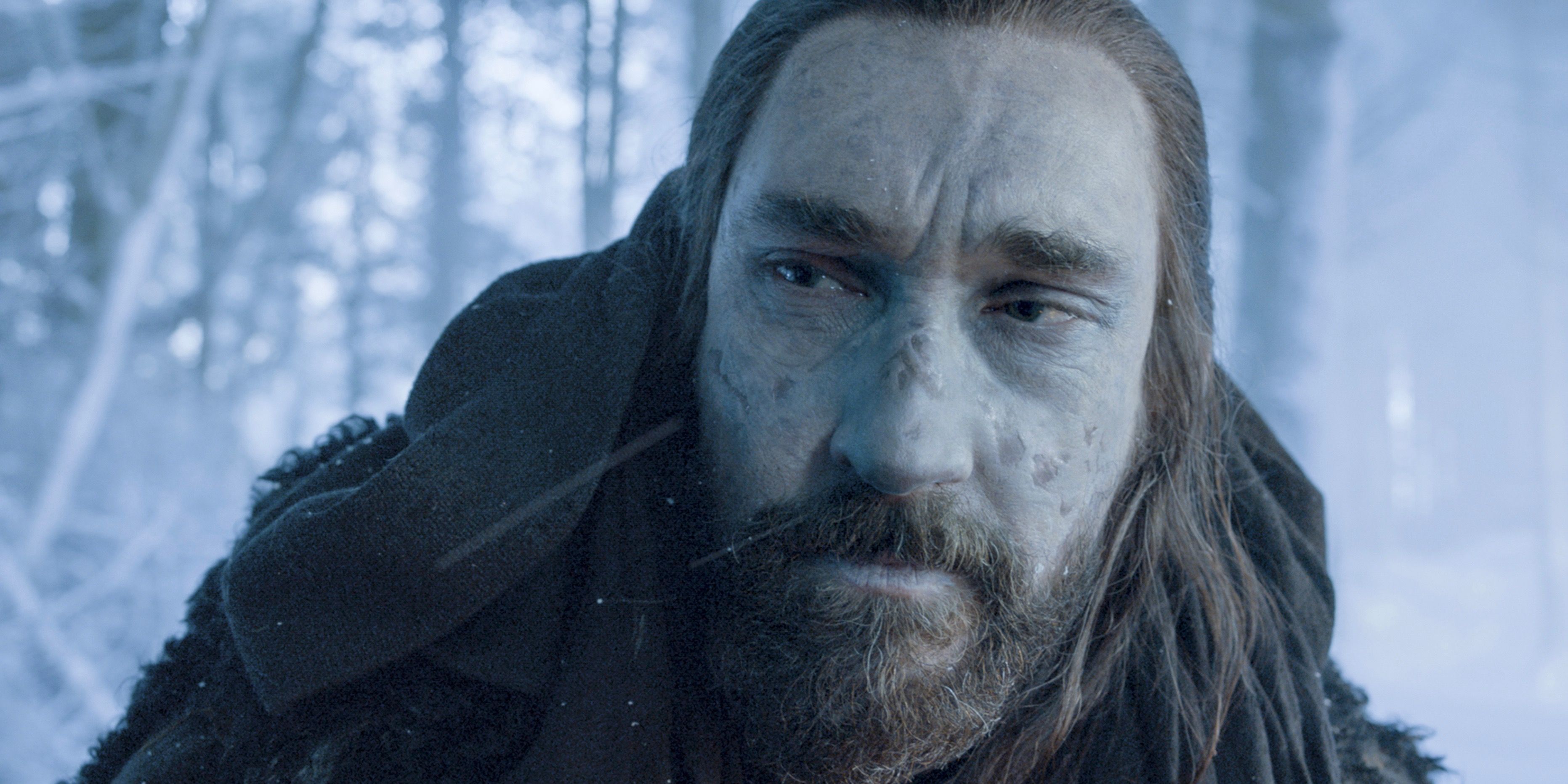 Benjen Stark standing in a snowy forest in Game of Thrones