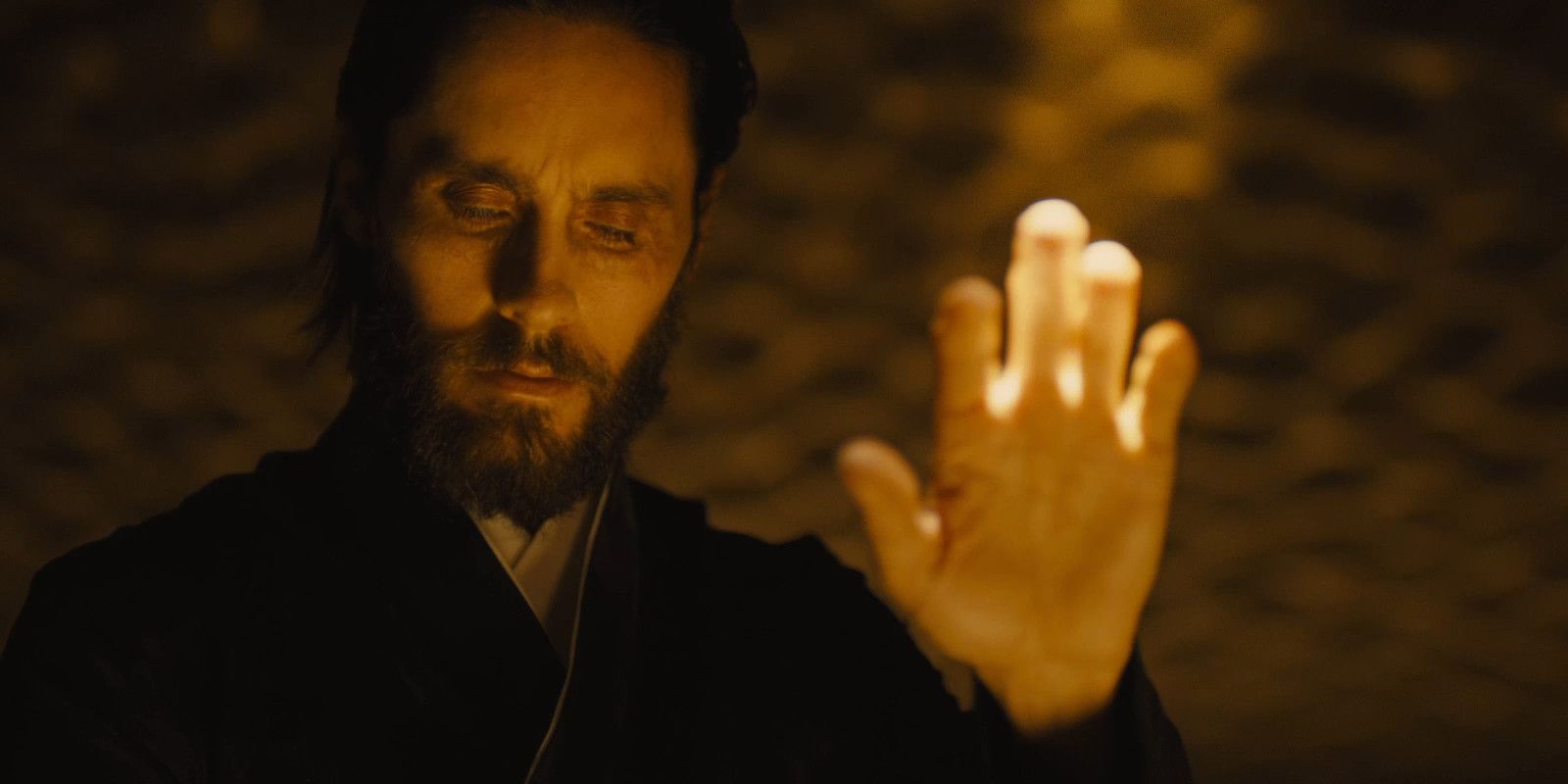 Niander Wallace holds up his hand in his chamber in Blade Runner 2049