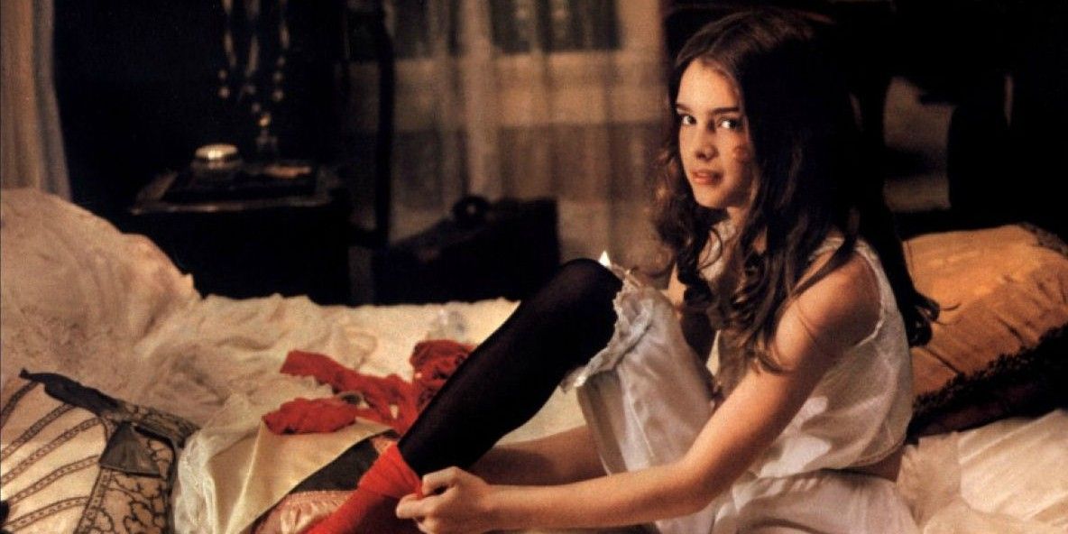 Brooke Shields as Violet putting on socks in Pretty Baby.