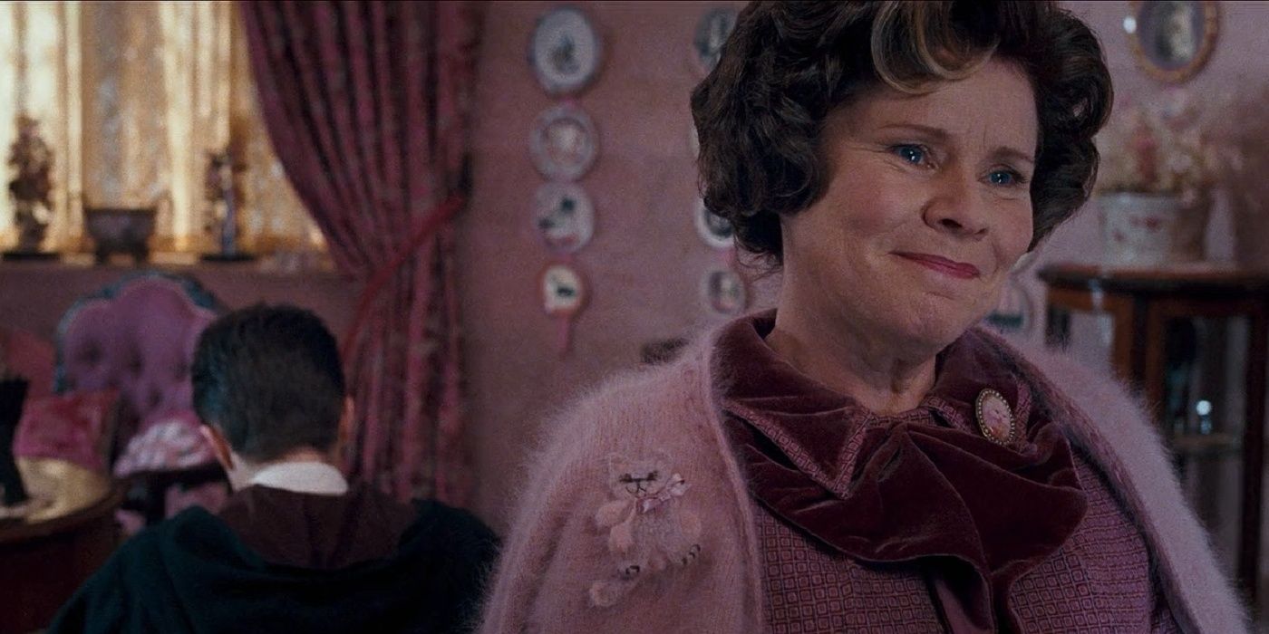 Umbridge smiles as Harry is in detention in Harry Potter and the Order of the Phoenix