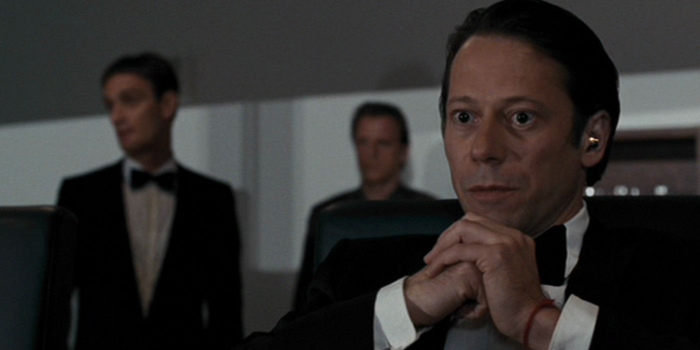 Dominic Greene sitting with his hands together in Quantum of Solace