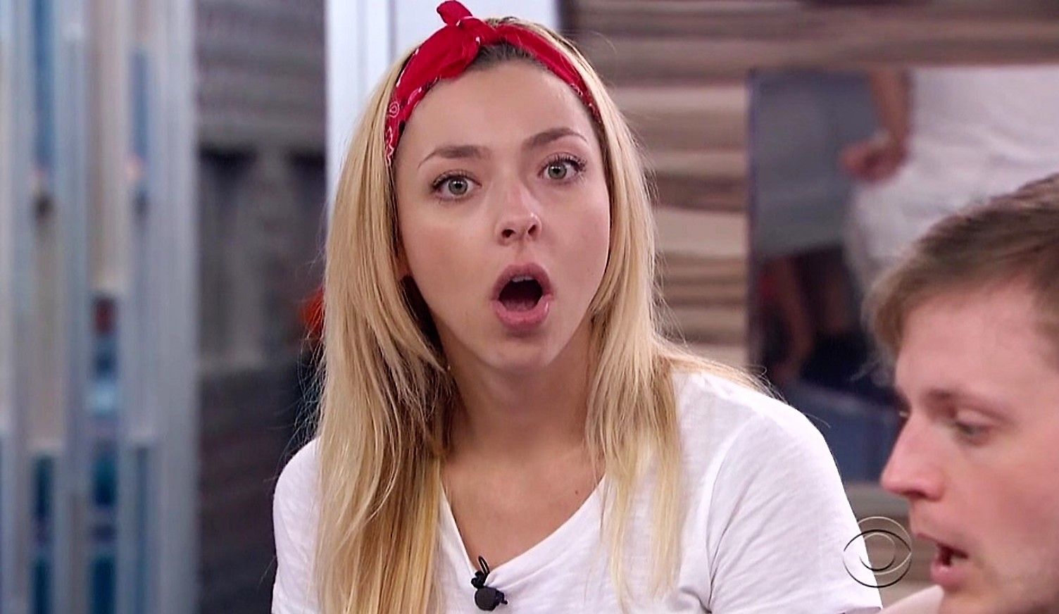 Liz Nolan from Big Brother wearing a red bandana and white shirt, mouth agape.