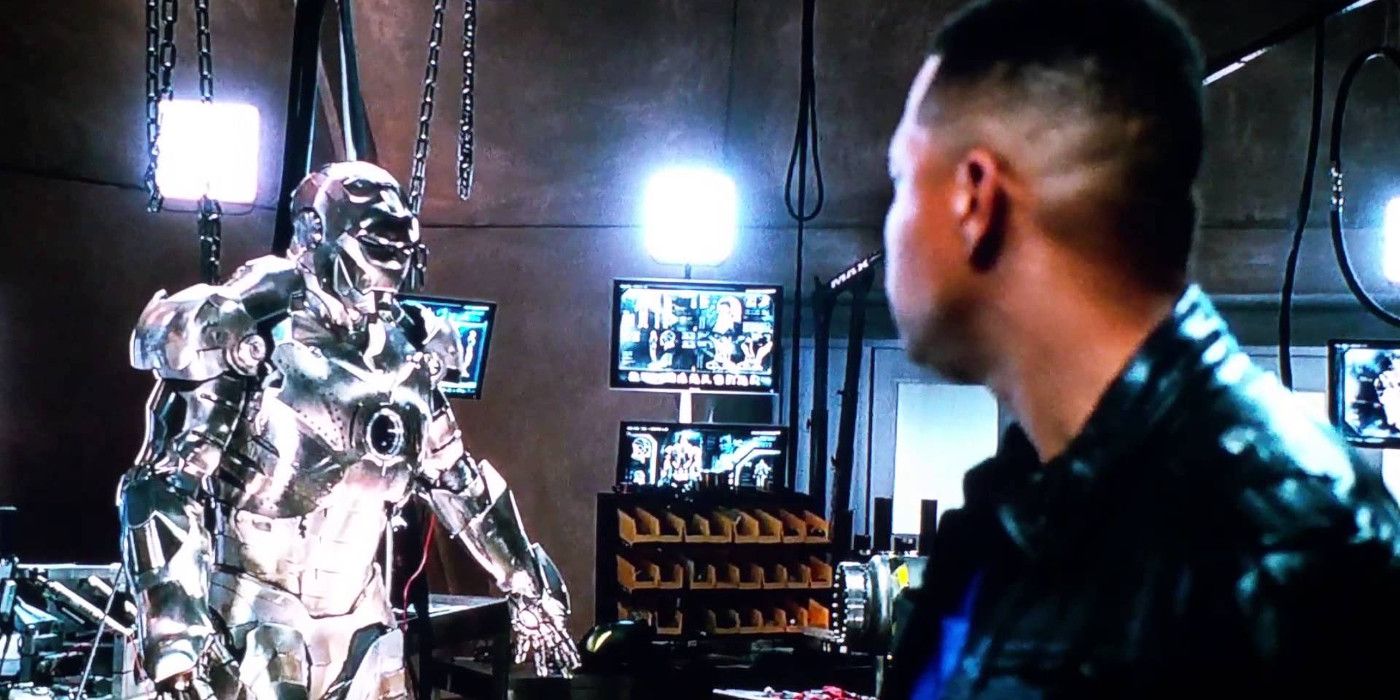 Rhodes looks at the War Machine armor in Iron Man