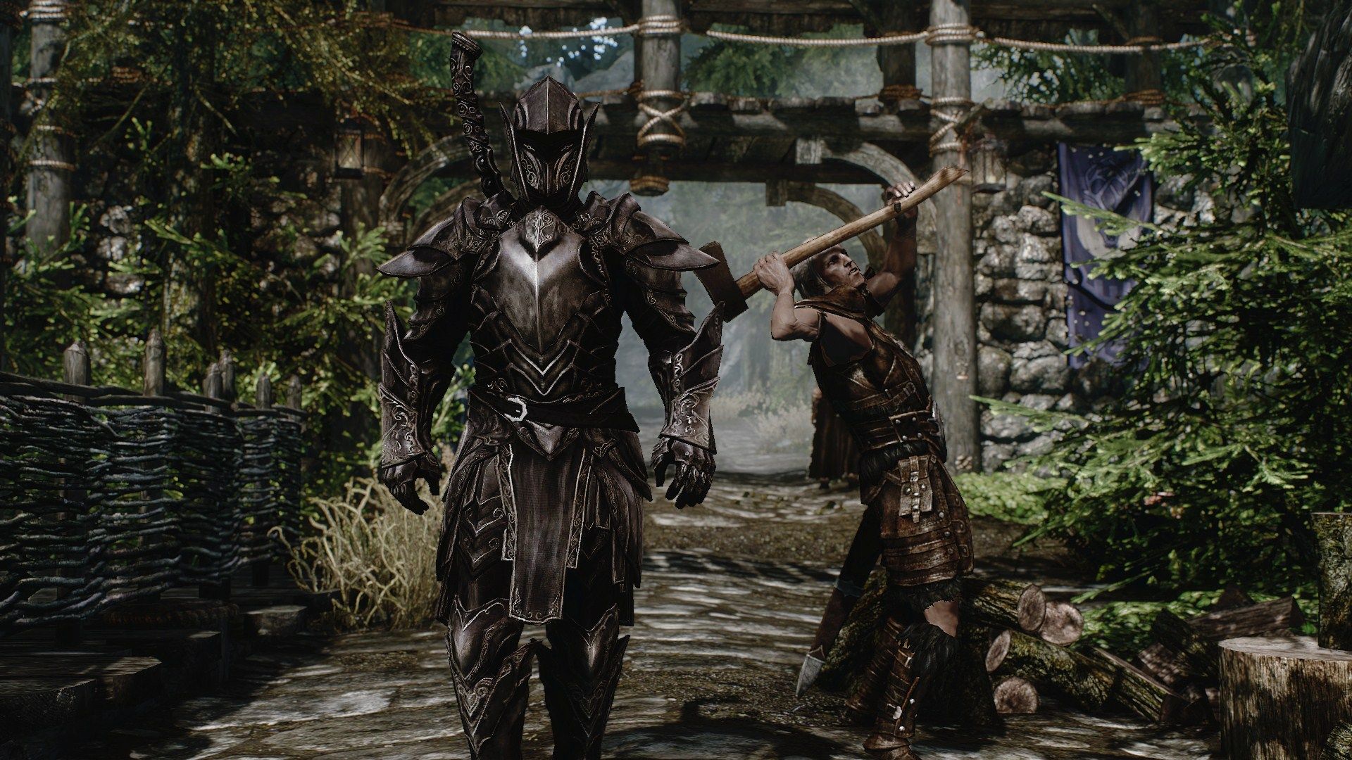 The Ebony Warrior walking through Falkreath while another character chops wood in the back.
