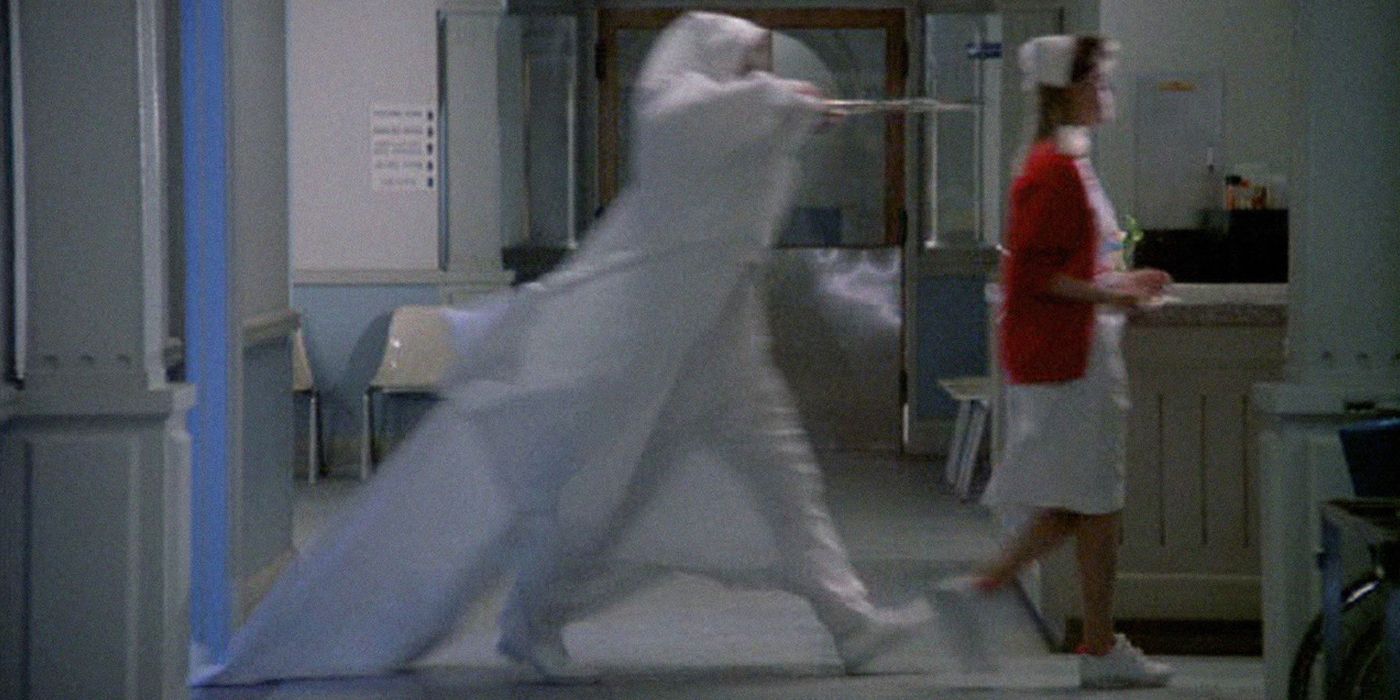 The Exorcist III Legion scene with gemini in a hooded cloak running after the nurse with shears