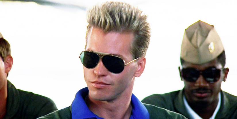 Val Kilmer in Top gun as Iceman wearing sunglasses in a classroom