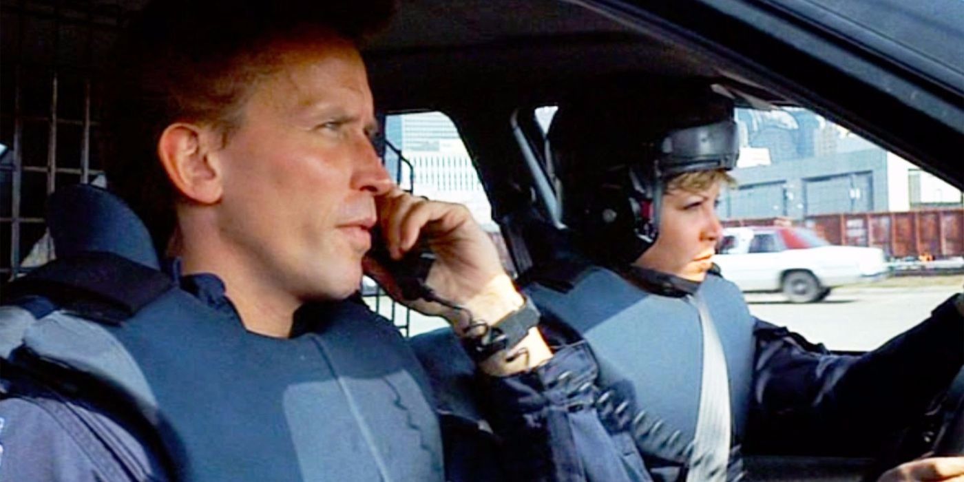 Alex Murphy and Anne Lewis in a car in RoboCop.
