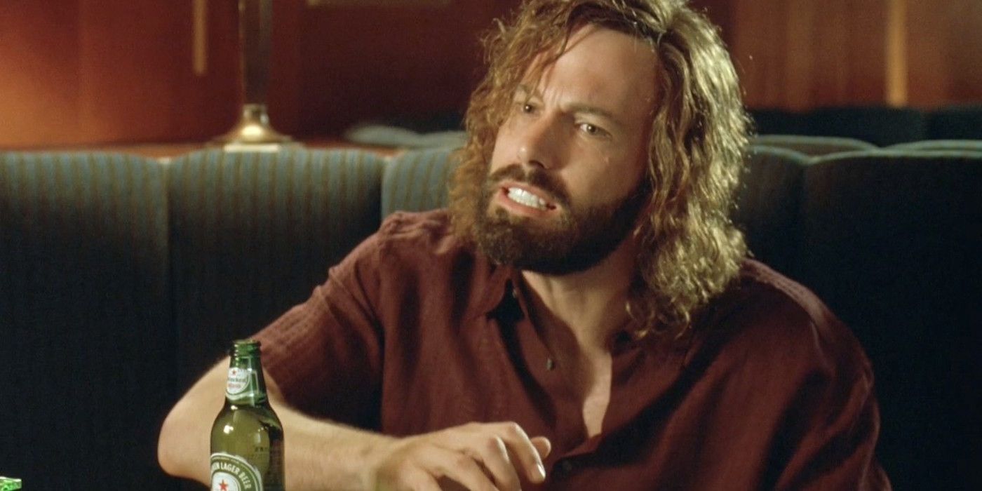 Ben Affleck's character sits at a restaurant with a beer in Extract