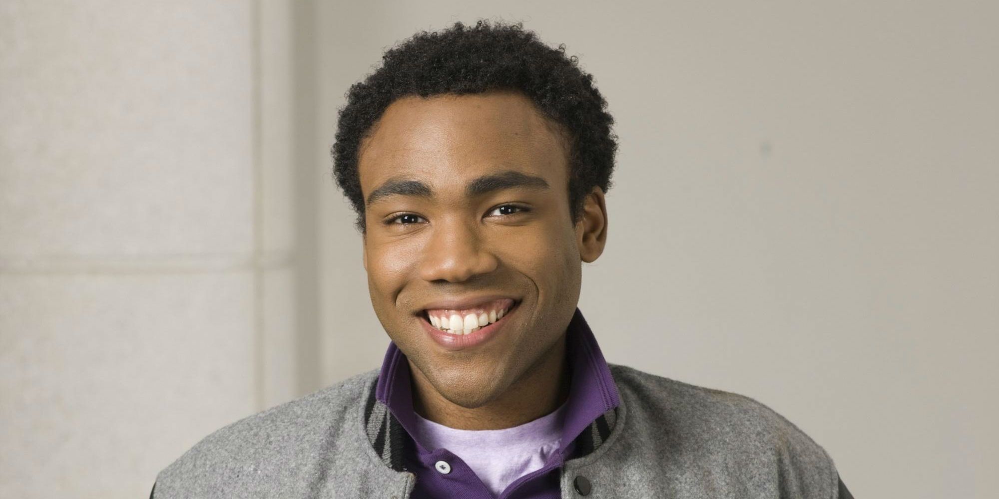 Tory Barnes smiling in a promotional photo for Community