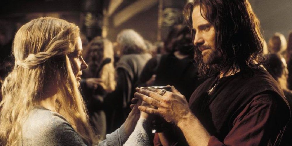 Eowyn and Aragorn share a drink in Lord of the Rings