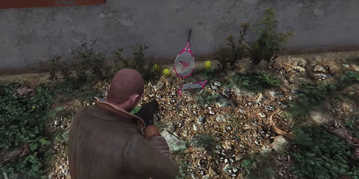Tennis rackets and balls lying at the foot of a wall in GTA 5.