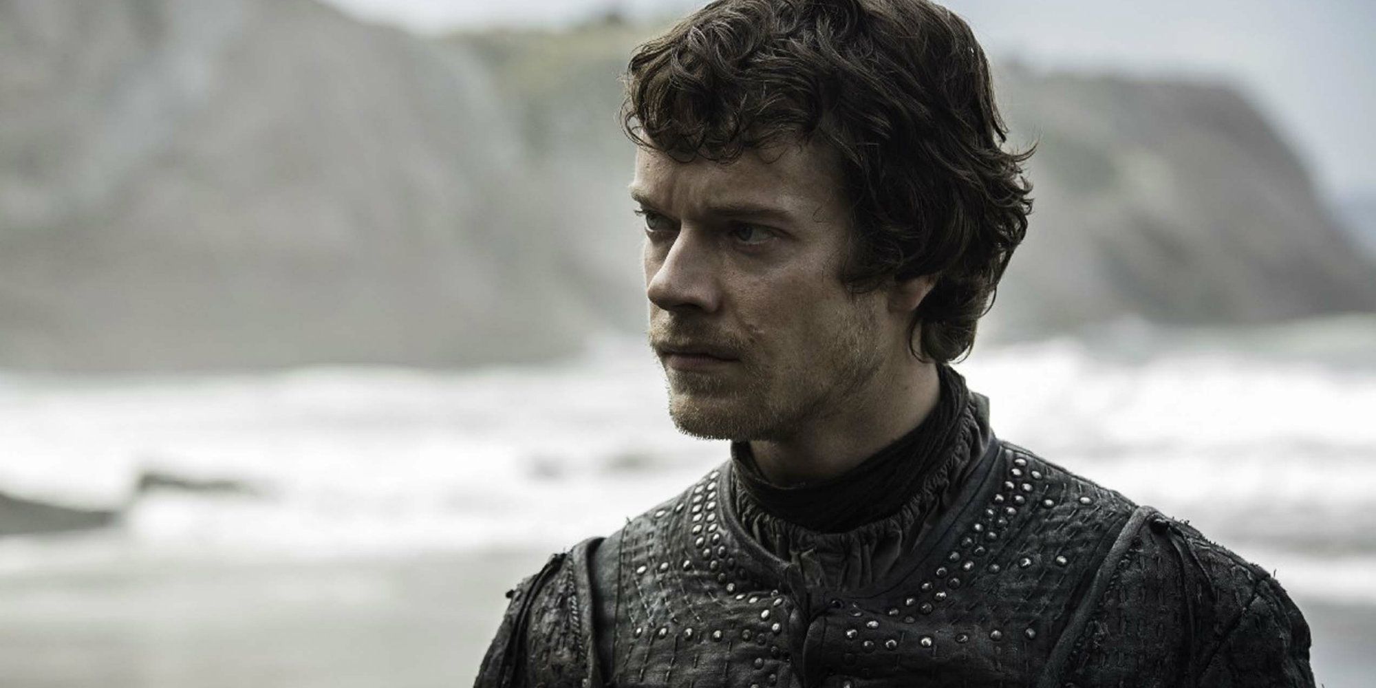 Theon Greyjoy standing on a beach in Game of Thrones