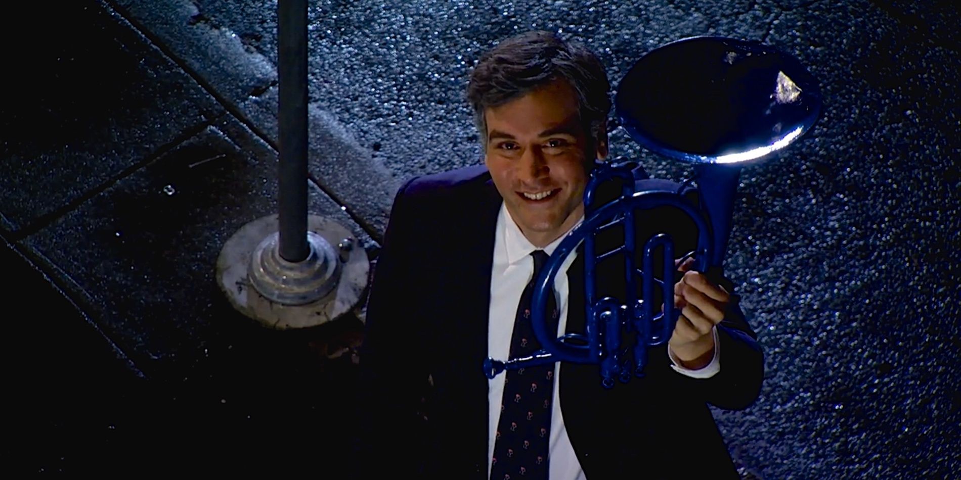 Ted holding the blue french horn in How I Met Your Mother.