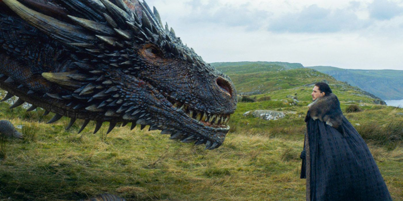 Jon Snow (Kit Harrington) standing infront of Drogon on Game of Thrones