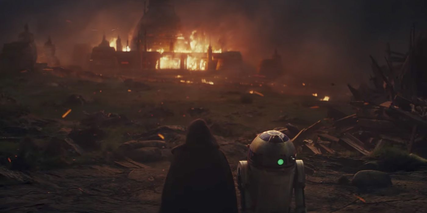 Luke Skywalker and R2-D2 watch his Jedi Temple burn