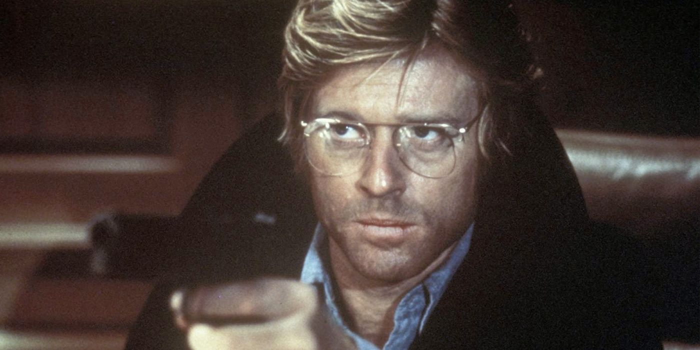 Robert Redford holding a handgun in Three Days of the Condor