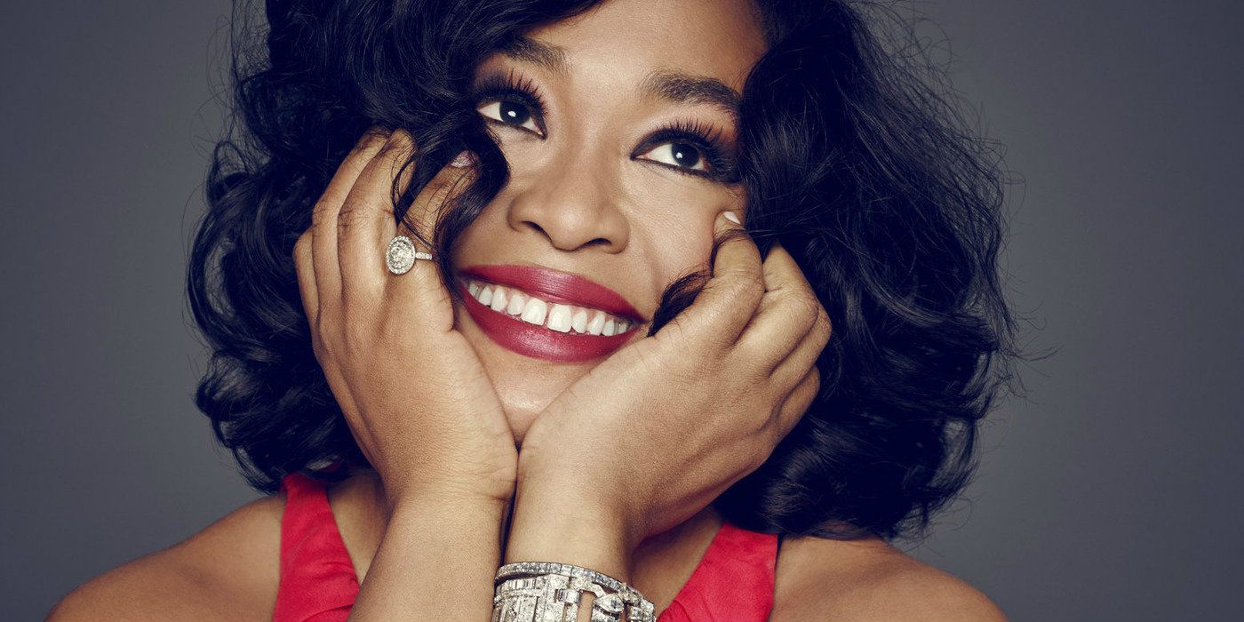 Shonda Rhimes with her hands on her face