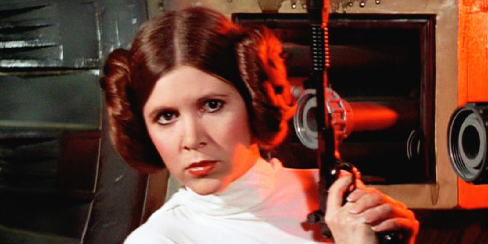 Princess Leia holding a blaster while peering around a bulkhead in A New Hope