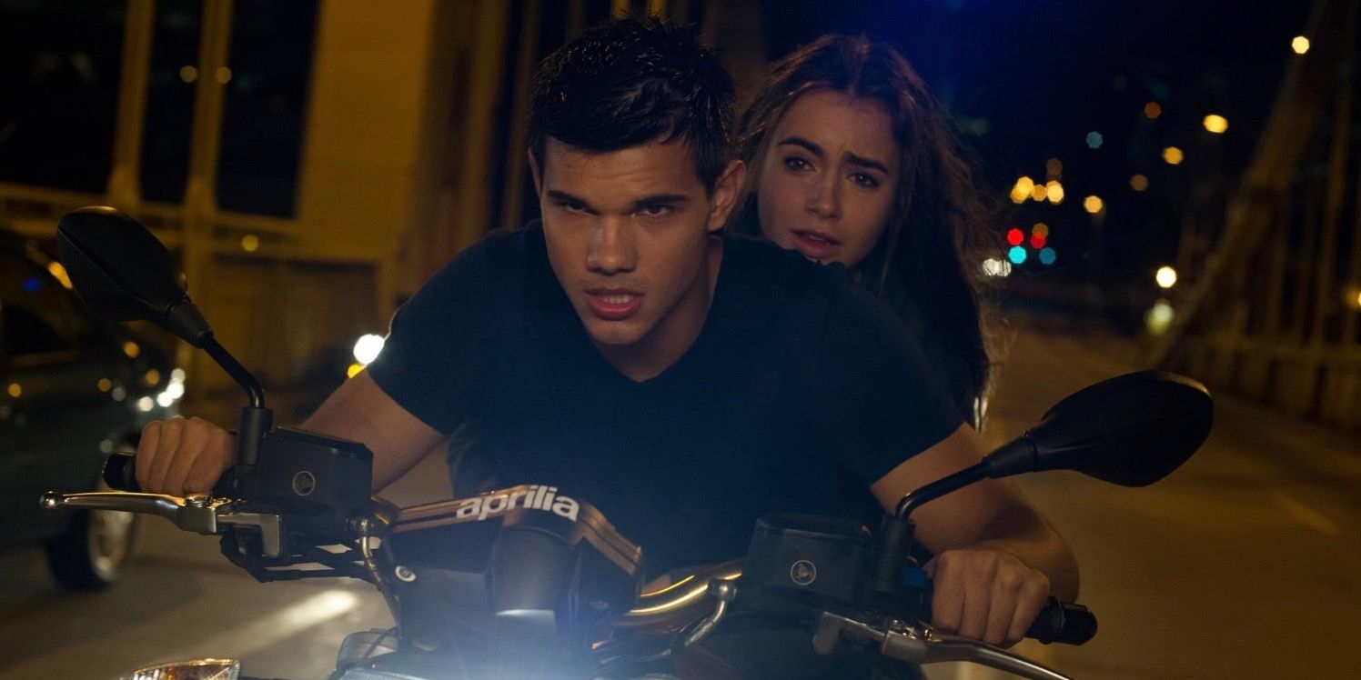 Taylor Lautner riding a motorcycle.