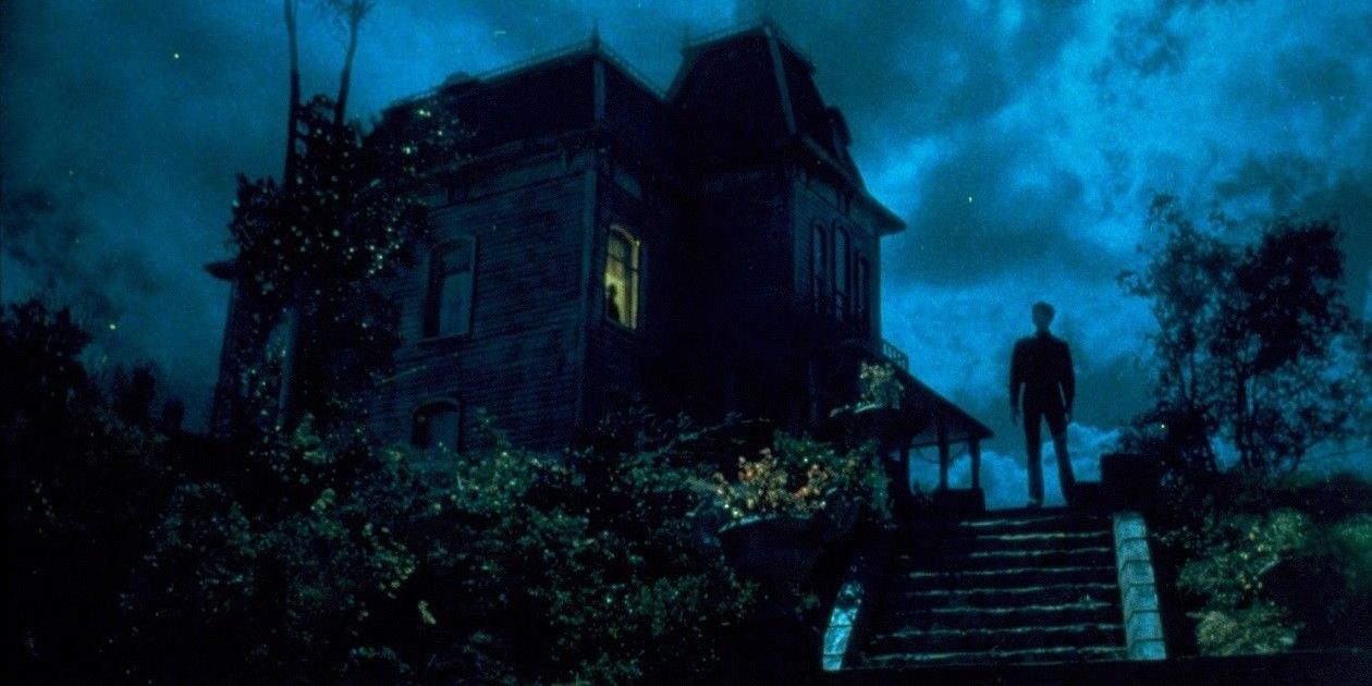 Norman standing in front of the Bates House in Psycho II