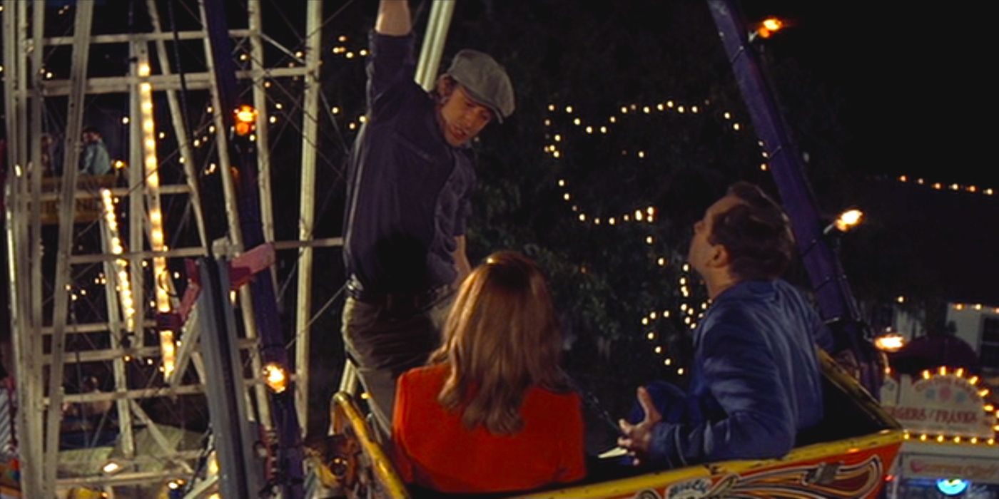 Moah hanging from the ferris wheel in The Notebook