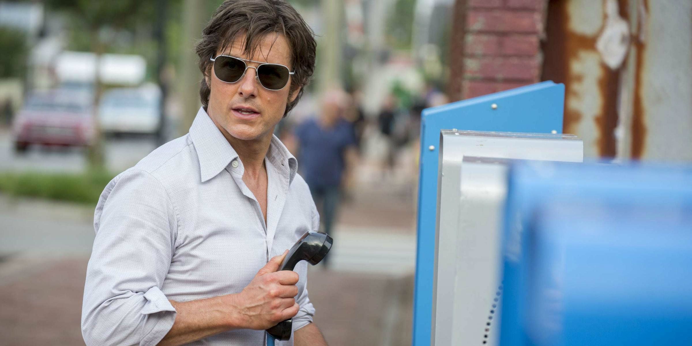 Tom Cruise using a pay phone in American Made