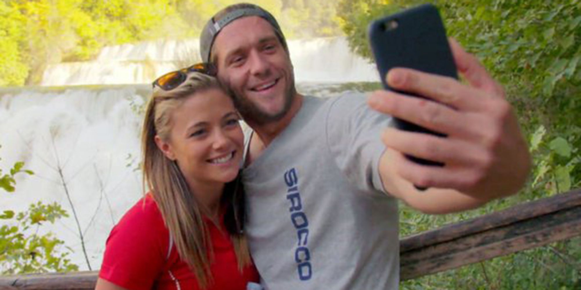 Below Deck Med's Malia and Adam posing for a selfie forest background
