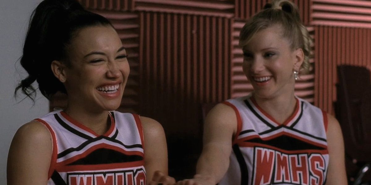 Brittany and Santana laughing in the choir room in Glee