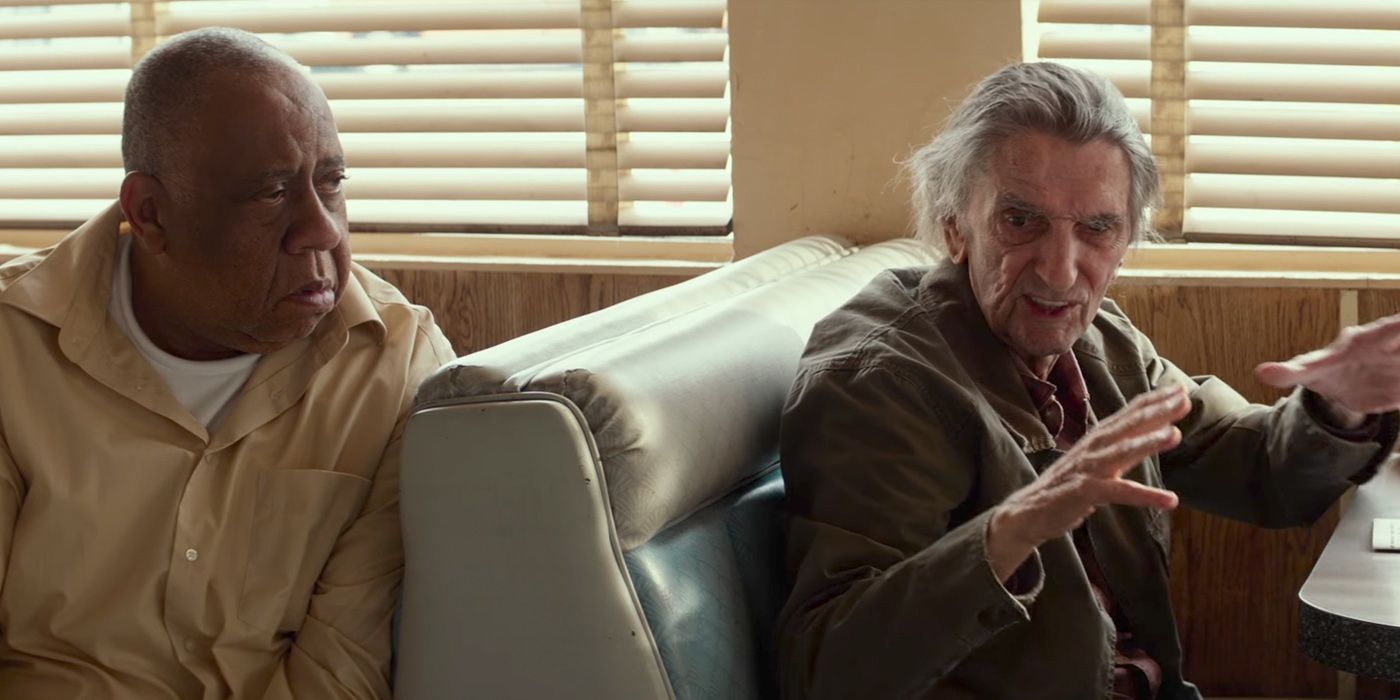 Harry Dean Stanton and Barry Shabaka Henley sitting in booths in a diner in Lucky