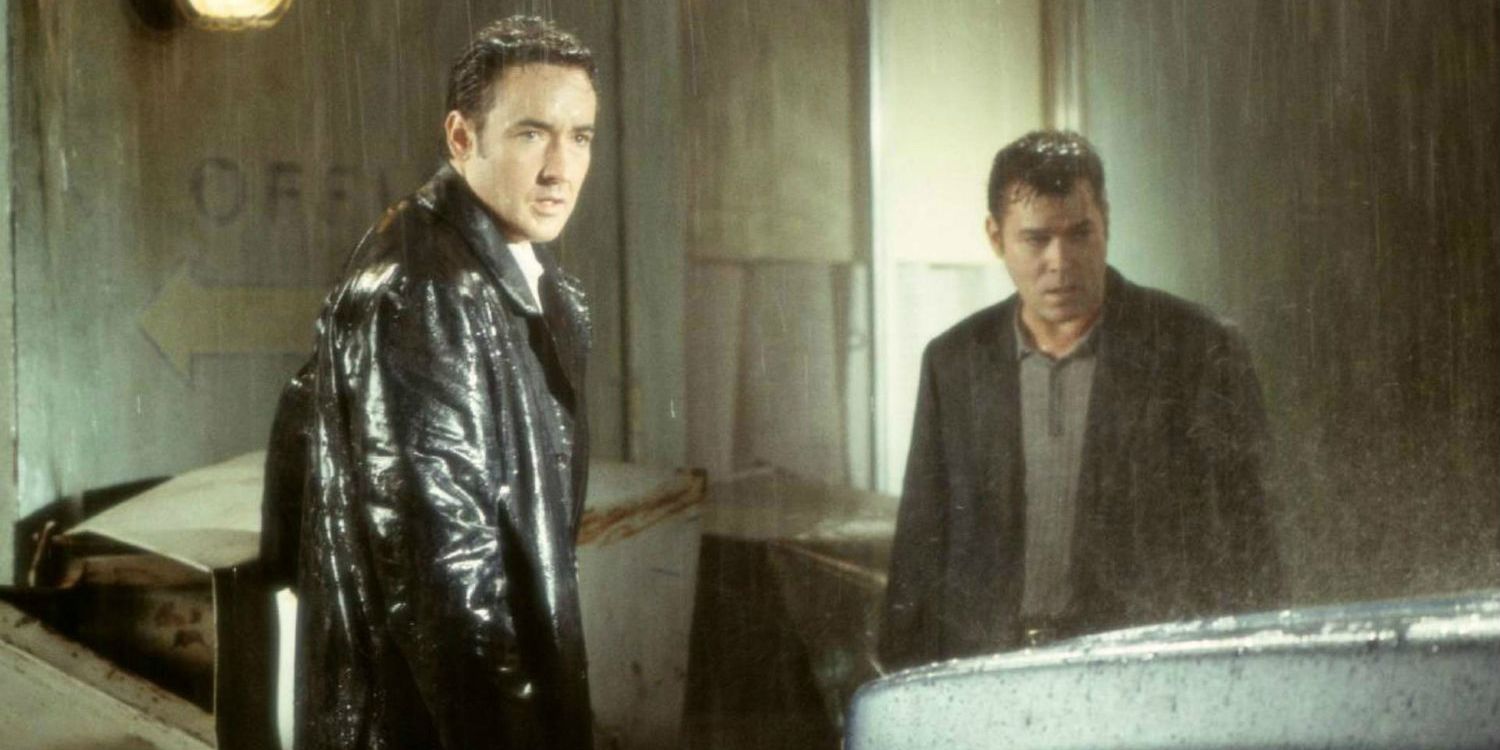 John Cusack and Ray Liotta standing in the rain in Identity 2003