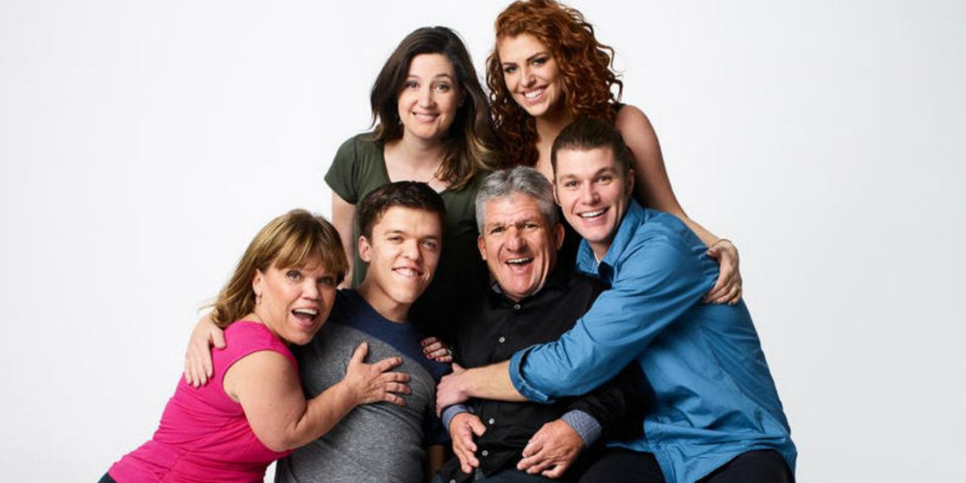 Little People Big World Cast posing together in front of white background in 2016