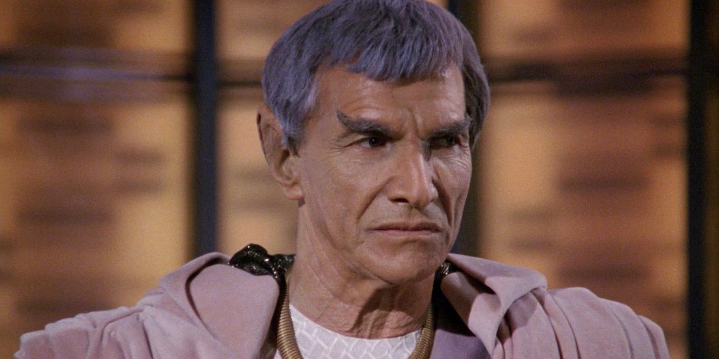 Sarek speaks while standing on the transporter pad from Sarek
