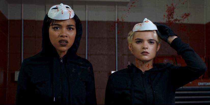 McKayla and Sadie in masks and wearing all black in Tragedy Girls
