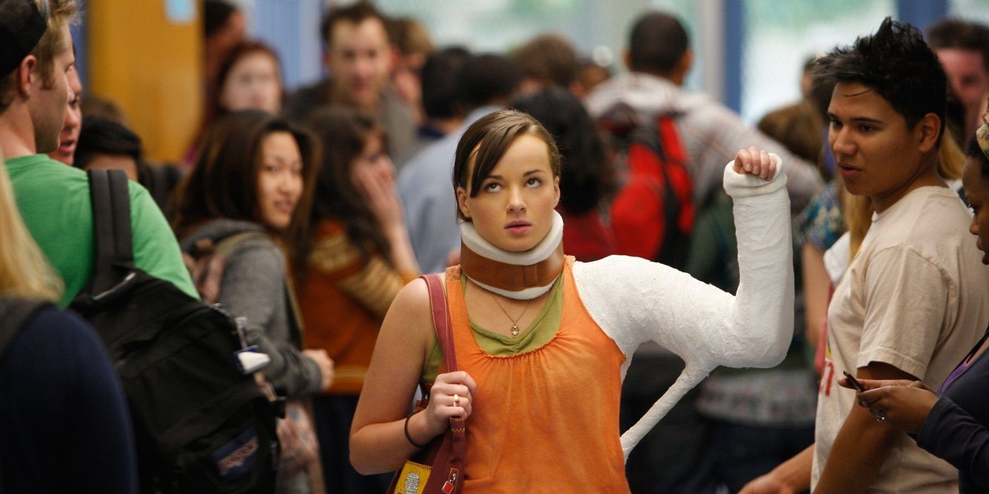 Jenna walking in school with arm cast in Awkward