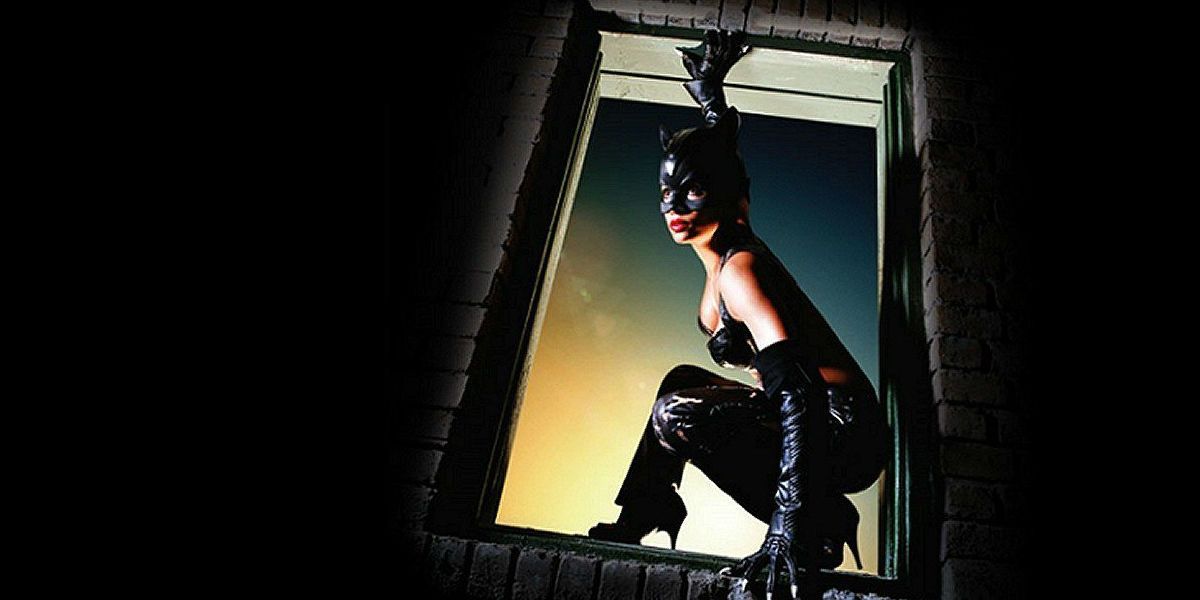 Halle Berry climbing a window in Catwoman